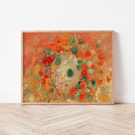 A fine art print of Odilon Redon's oil painting, Nasturtiums, from 1905, framed and displayed in a simple light wood picture frame against a white wall.
