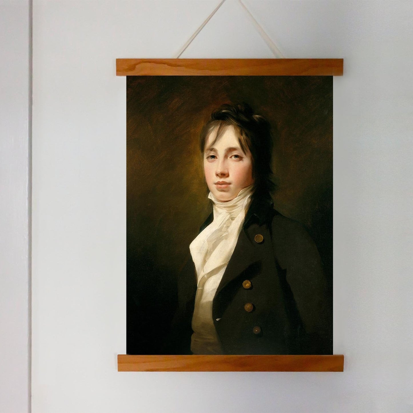 Portrait of a man in a dark coat with gold buttons on a wooden frame against a white wall.