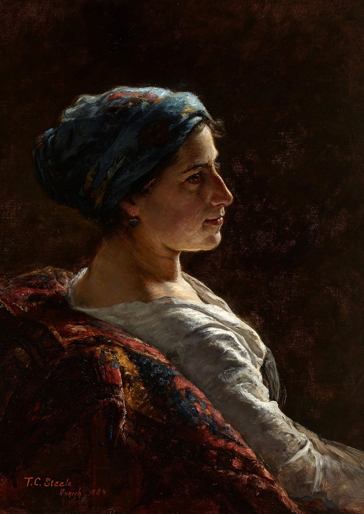 A female portrait print of a lady sitting on a chair in the light of a window.