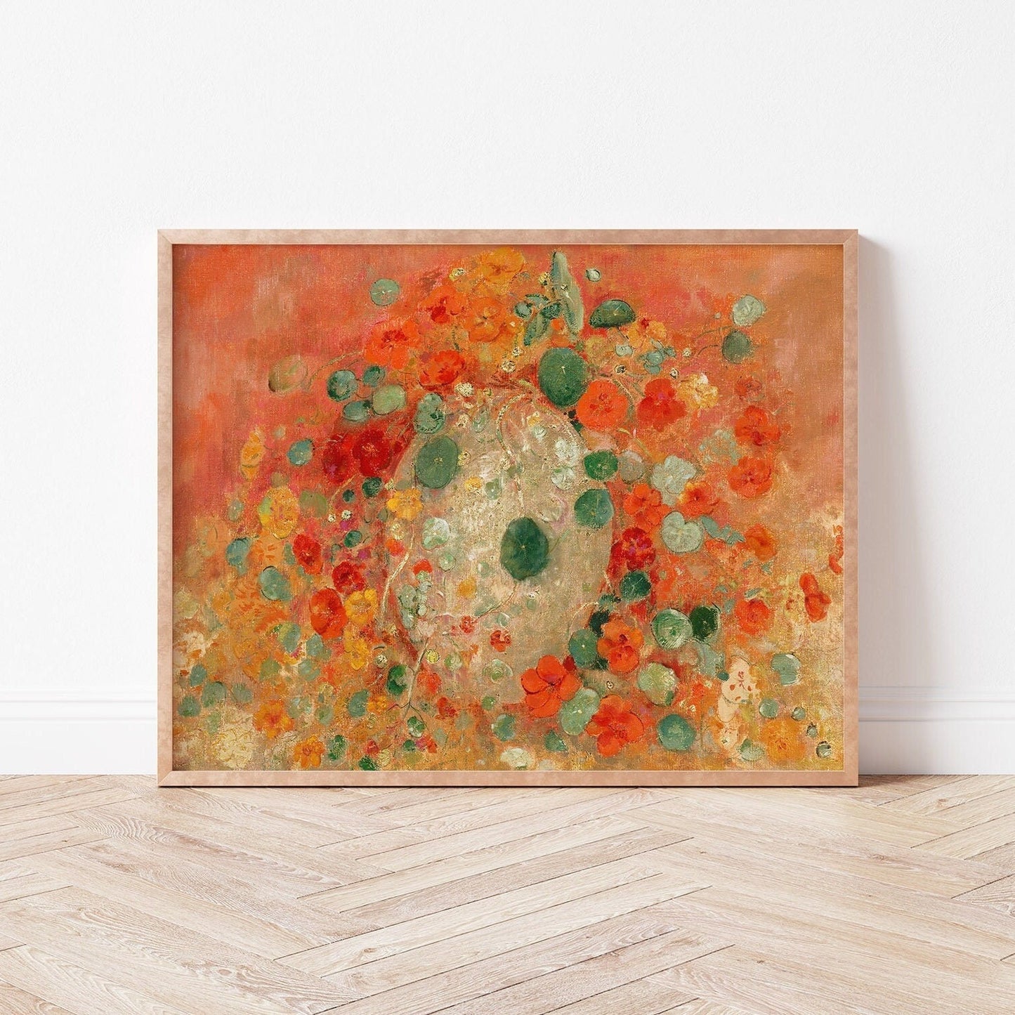 A fine art print of Odilon Redon's oil painting, Nasturtiums, from 1905, framed and displayed in a simple light wood picture frame against a white wall.
