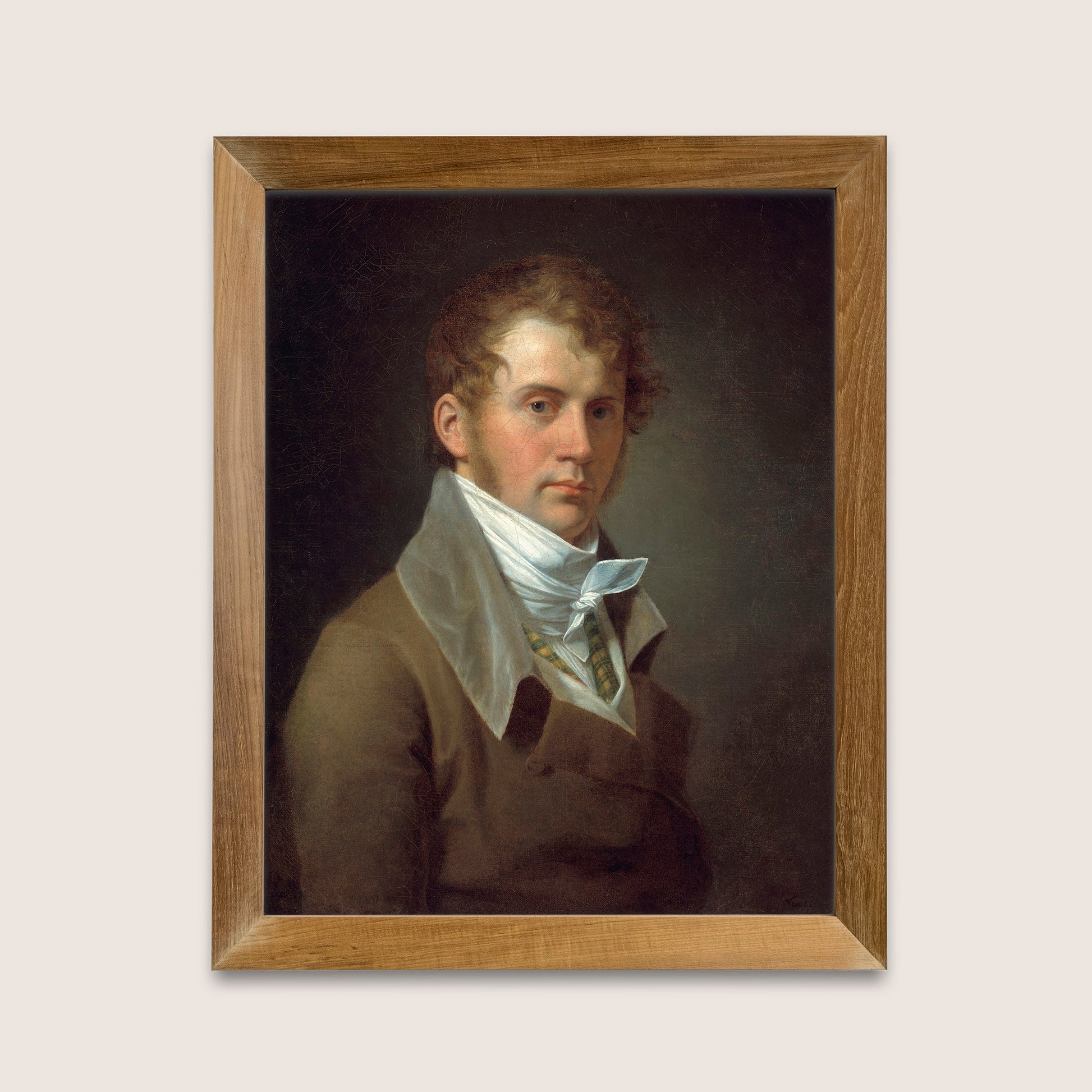 Framed portrait of a man with a white cravat on a light gray background