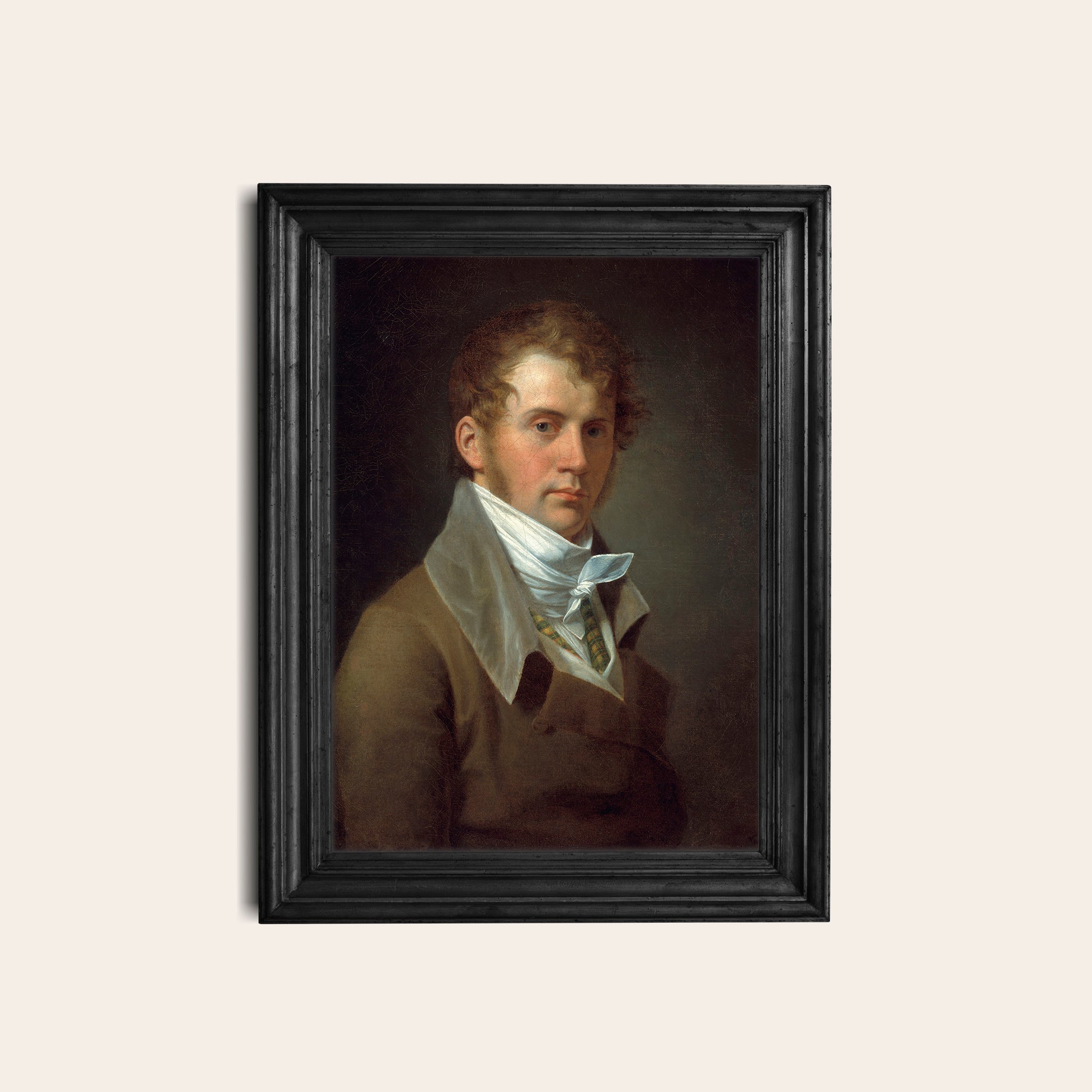 Framed portrait of a man with a white cravat on a dark background