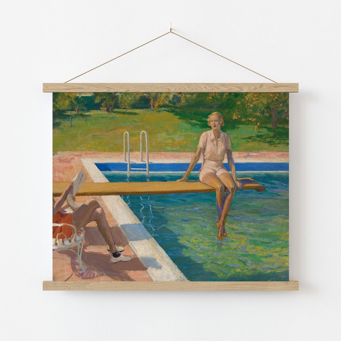 A fine art print of a beautiful Art Deco portrait in oil of a young lady resting on a spring board above a swimming pool. The print is displayed hanging on the wall in a wooden poster hanger.