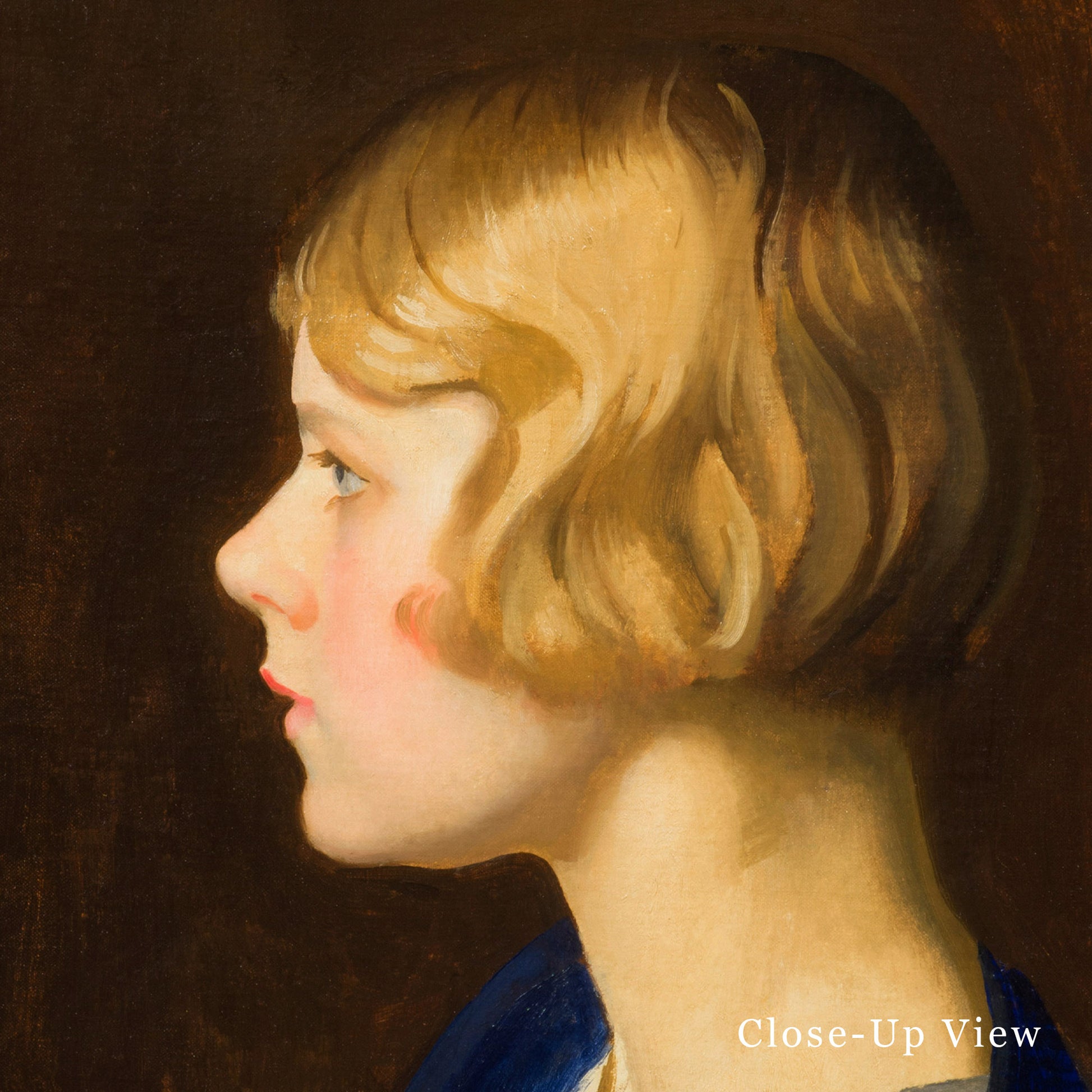 Close-up of a young lady with blonde hair and blue eyes, wearing a blue top.