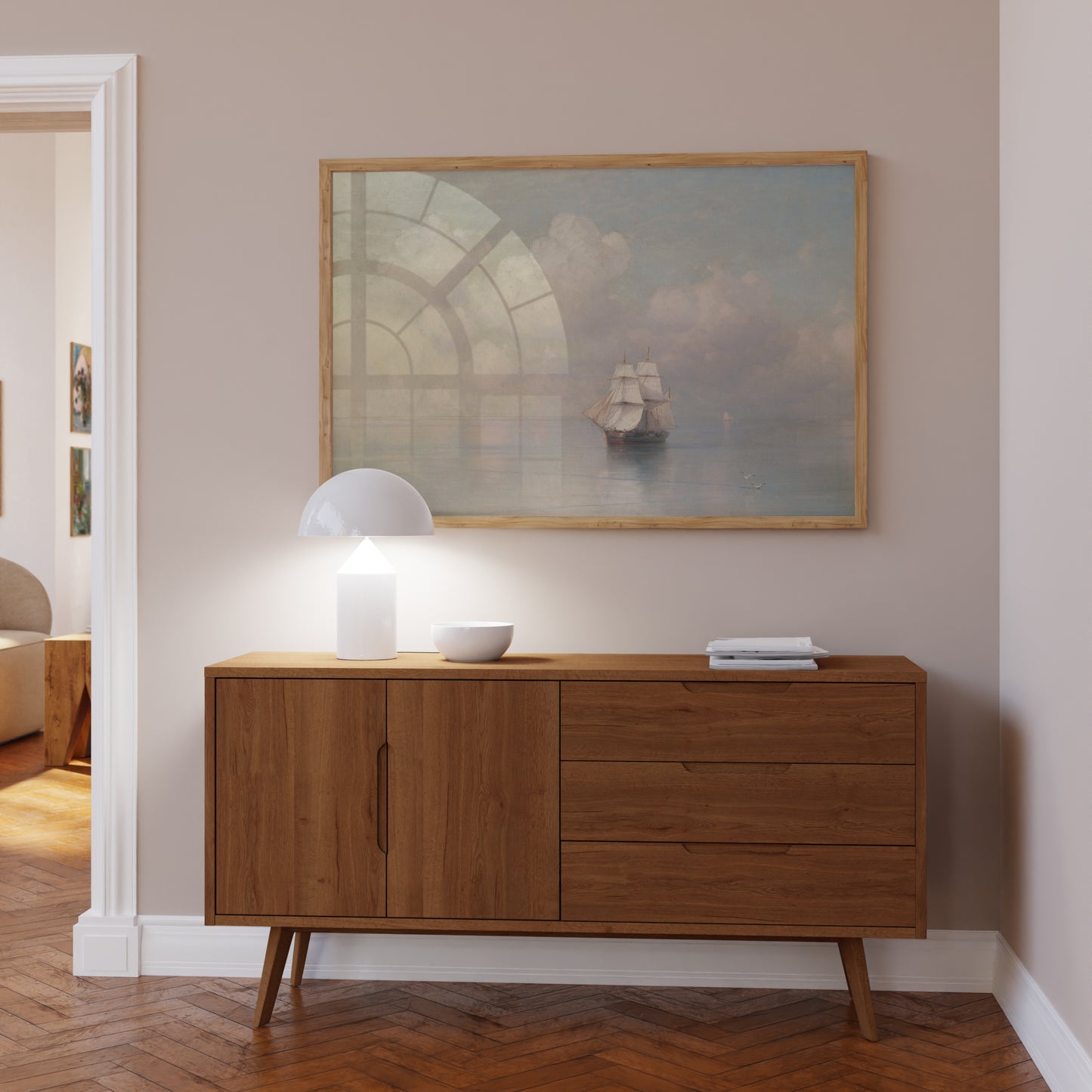 Wooden sideboard in a room with a painting of a ship on the wall.