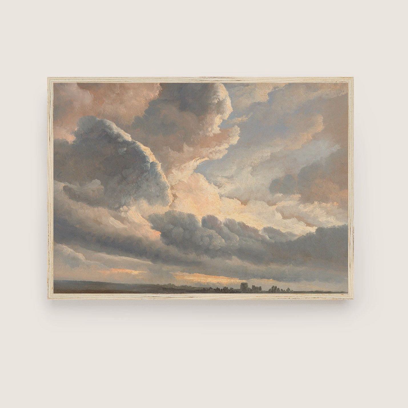 Framed painting of a dramatic sky with clouds on a white wall