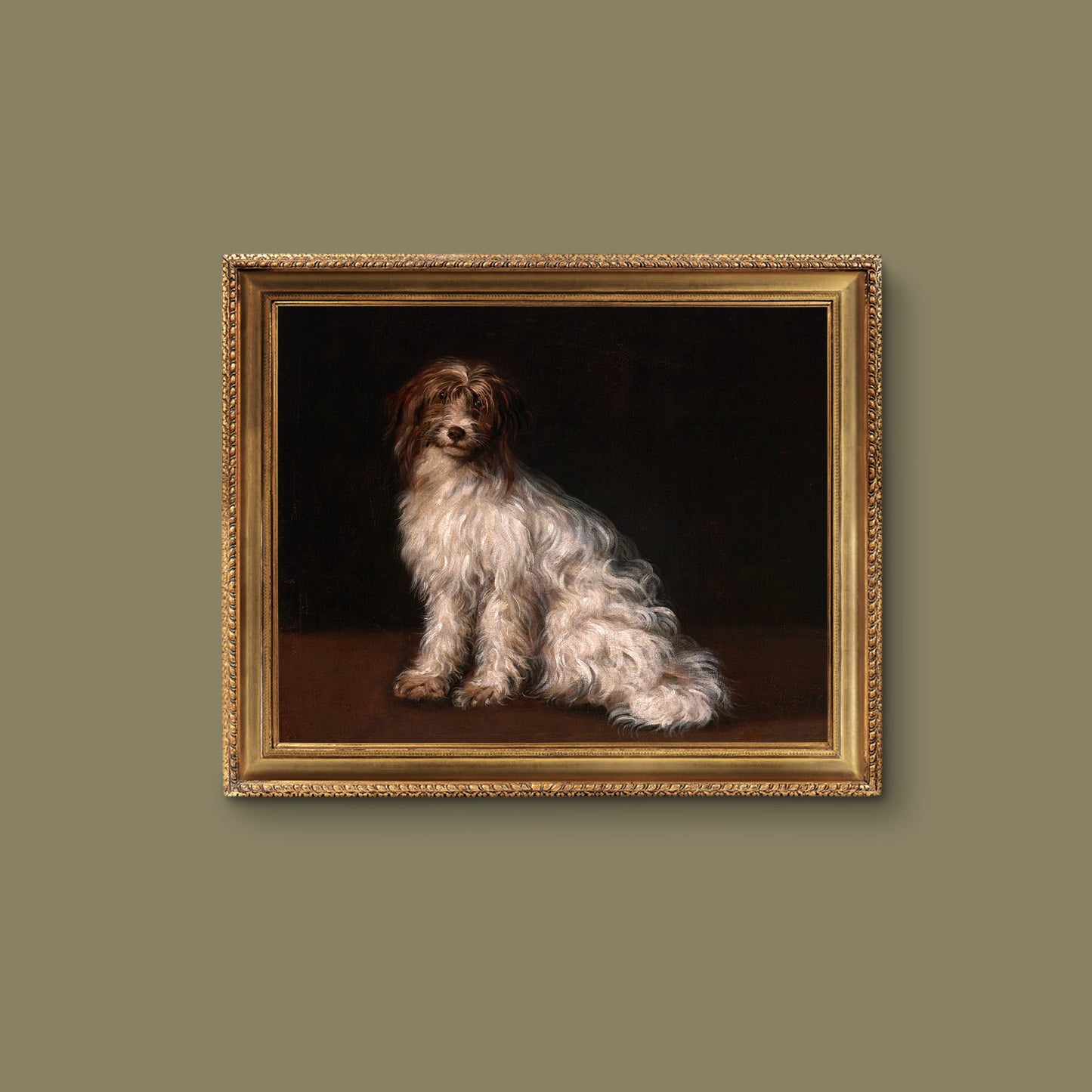 Gold framed artwork of a terrier dog painted on a dark background, hanging on a sage green wall.