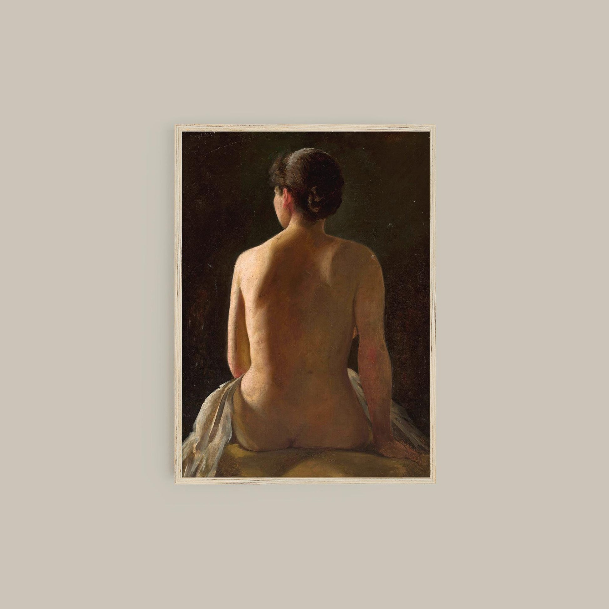 Framed print of a nude figure sitting with a wooden frame.