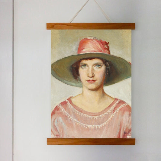 A fine art print of an Art Deco painting of a portrait of a lady. The print is displayed hanging on the wall in a wooden poster hanger.