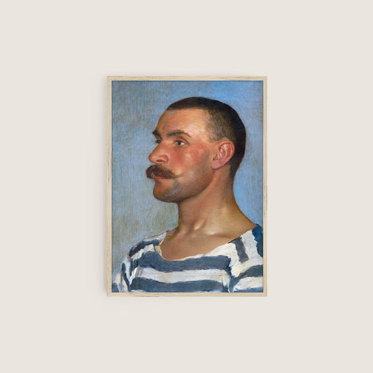 Framed portrait of a man with a mustache hung on a light background