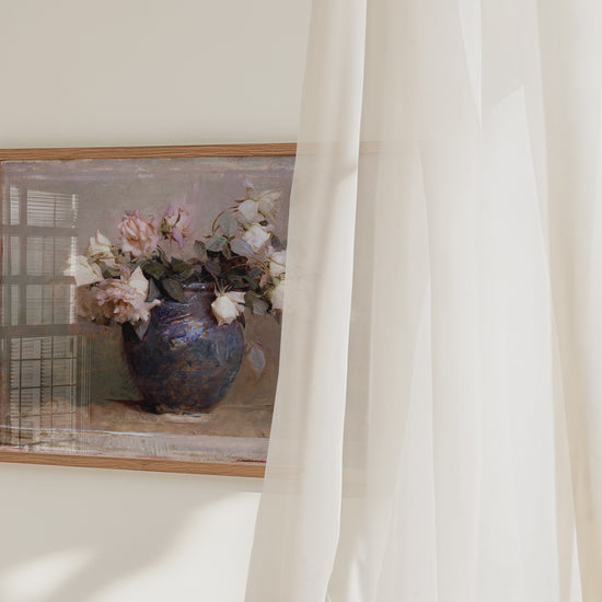 A video panning across a framed fine art print of a vase with roses.