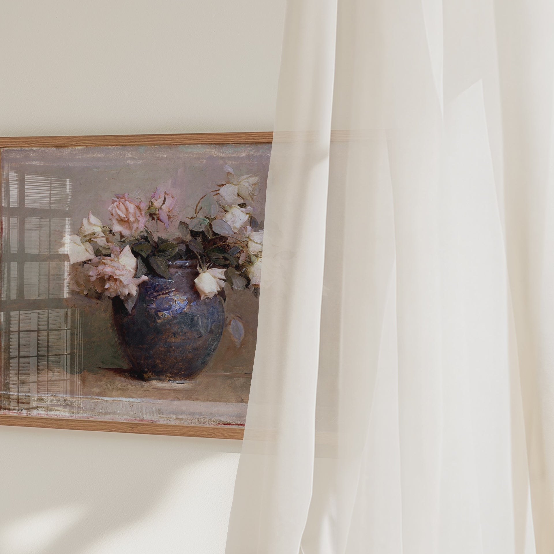 A video panning across a framed fine art print of a vase with roses.