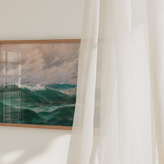 A video of a framed fine art print of a turbulent sea and sky.