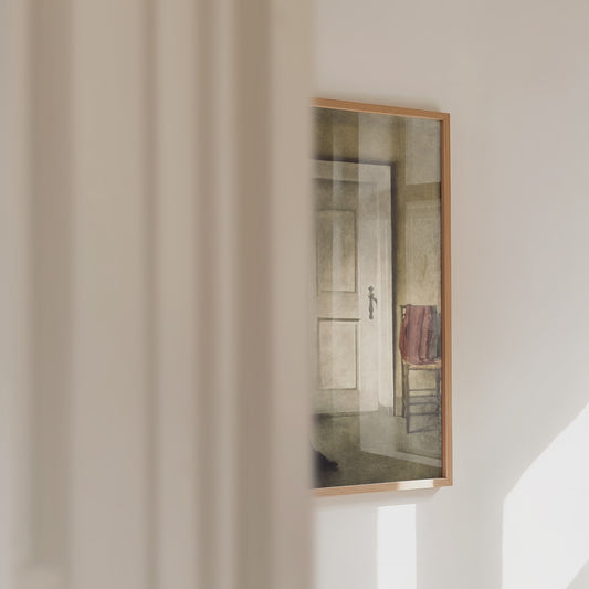 Video of a framed print of a lady reading panning across.