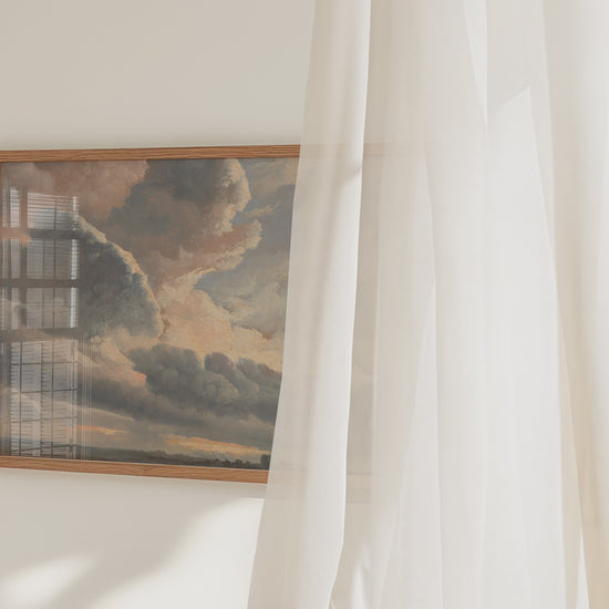 A video of a framed cloud study print