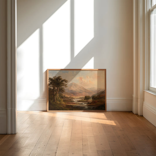 Framed landscape painting on a wall in a bright room with sunlight streaming through windows.