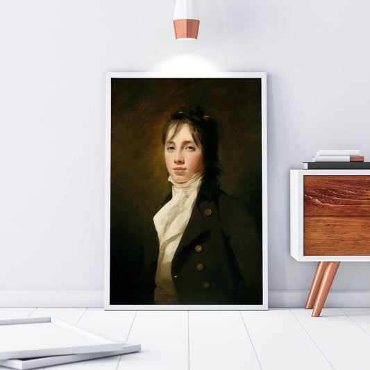 Framed portrait of a man in formal attire on a white wall with modern decor.